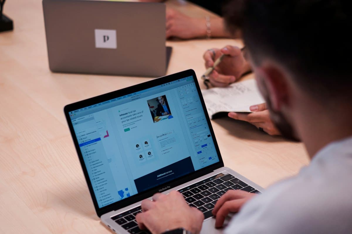 Someone working on a laptop at a desk