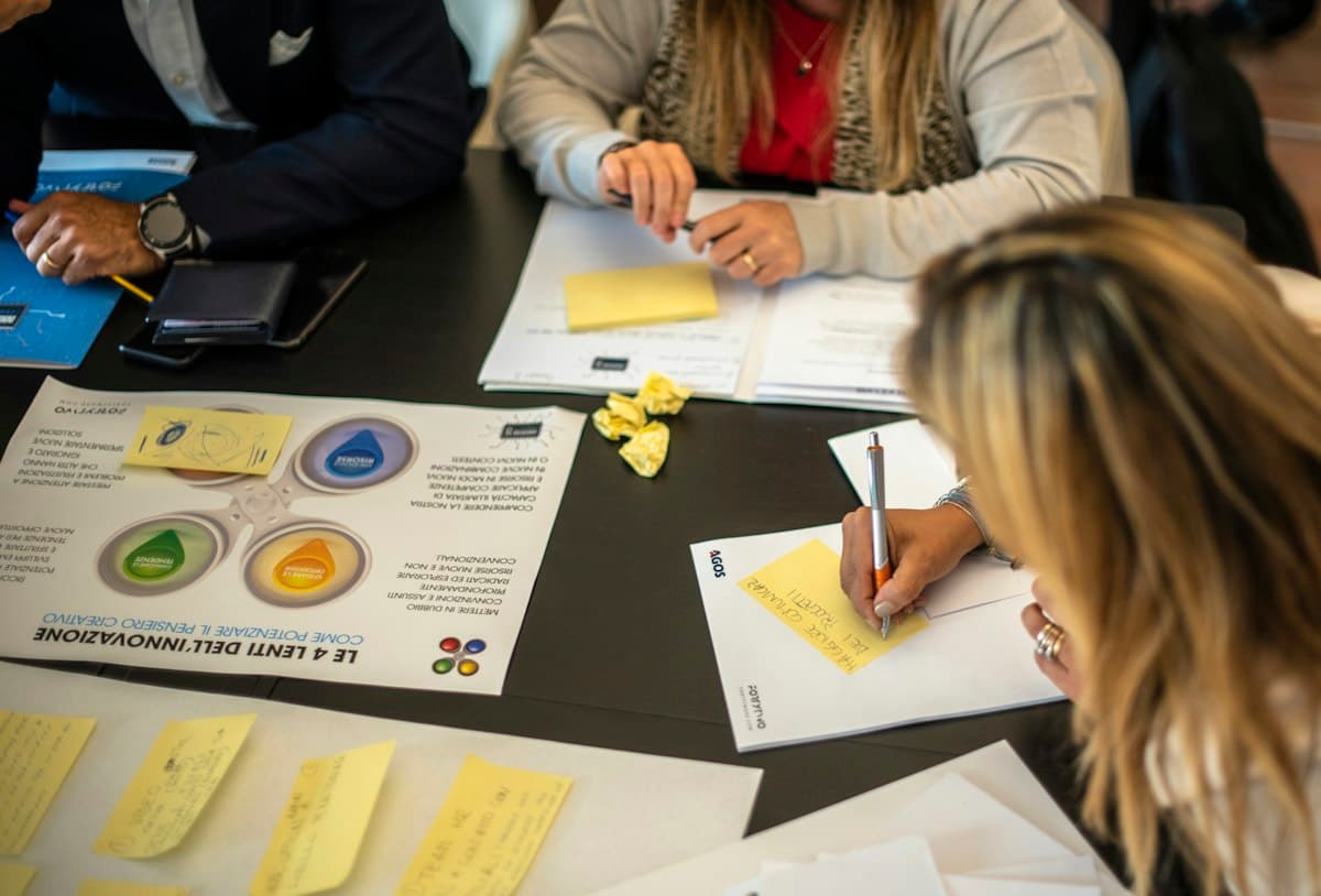 A team working through papers around a table